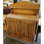 Victorian pine sideboard with gallery top and two blind panelled doors on a platform base. (B.P.