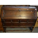 Early 20th Century oak Jacobean style fall front bureau on shaped stretchers and barley twist