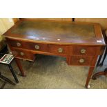 Edwardian mahogany inlaid bow front writing desk with leather inset top on square tapering legs and