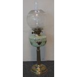 Eary 20th century brass double burner oil lamp with moulded coloured glass resevoir,