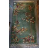 Modern turquoise ground foliate wash ground type rug. (B.P. 24% incl.