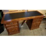 Good quality modern Mexican pine pedestal desk with recessed handles and leather top. (B.P.