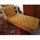 Early 20th Century yellow ground button back chaise longue. (B.P. 24% incl.