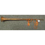 A copper and brass horn with tassel. (B.P. 24% incl.
