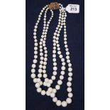 A vintage three strand costume jewellery necklace. (B.P. 24% incl.