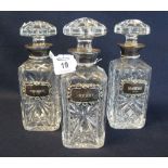 A set of three hob nail cut square section decanters with mushroom stopper,