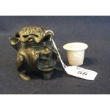 Novelty bronze inkwell in the form of a grotesque figure with animal hind legs and feet. (B.P.
