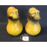 A pair of unusual novelty water jugs in the form of monkeys heads, probably continental. (2) (B.P.