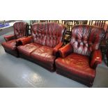 Modern ox blood Chesterfield type button back three piece suite comprising;