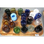 A tray of assorted moulded and coloured glass jars or possibly night light holders. (B.P. 24% incl.