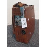 Courtnay Magna IIIE wooden cased accumulator battery with leather caddie handle. (B.P. 24% incl.