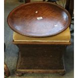 19th Century oak concave stool with hinged lid, together with a circular wooden tray. (2) (B.P.