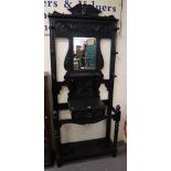 Late Victorian heavily carved and stained mirror back hallstand. (B.P. 24% incl.