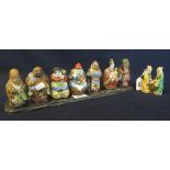 Kutani Japanese porclain figurines depicting the seven gods of fortune in polychrome enamels