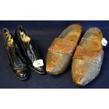 A pair of early 20th Century ladies black patent leather shoes, marked KDS to the sole,