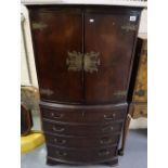Reproduction mahogany bow front cabinet having four long drawers and bracket feet,