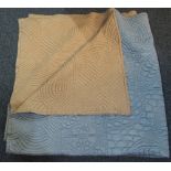 Vintage quilt, pale blue one side and orange the other with sewn in floral and leaf designs. (B.P.