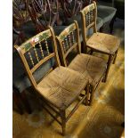 A pair and one similar early 20th Century spindle and bar back bedroom chairs on rush seats with