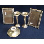 Silver capstan shaped inkwell, pair of silver mounted photograph frames,