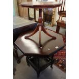 Edwardian oak octagonal table with under tier on casters,