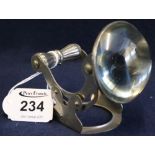 Early 20th Century French nickel plated magnifying glass with bullion lens and adjustable stand.