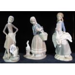 Two Lladro Spanish porcelain figurines together with a Nao Spanish porcelain figurine of a girl