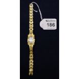 Ladies gilt metal bracelet watch with mother of pearl rectangular face. (B.P. 24% incl.