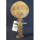 African carved wooden standing figure, woman with large geometrically decorated head,
