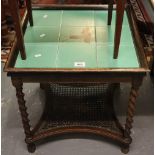 Early 20th Century oak tile top occasional table on barley twist supports with cane under tier. (B.