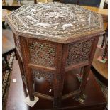 Middle Eastern design heavily carved and pierced octagonal table. (B.P. 24% incl.