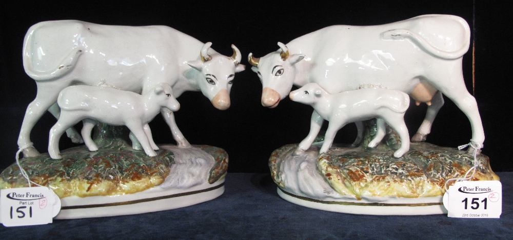 Pair of Staffordshire style cow and calf studies on naturalistic base, modern. (B.P. 24% incl.