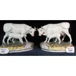 Pair of Staffordshire style cow and calf studies on naturalistic base, modern. (B.P. 24% incl.