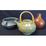 Three art pottery items to include; celadon glazed teapot with wicker handle of baluster form,