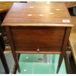 Small mahogany box on stand of rectangular form with hinged lid and pull out drawer. (B.P.