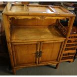 Modern oriental hardwood two tier sideboard or cabinet having two blind panelled doors on bracket