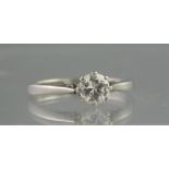 A PLATINUM AND DIAMOND SOLITAIRE RING. T