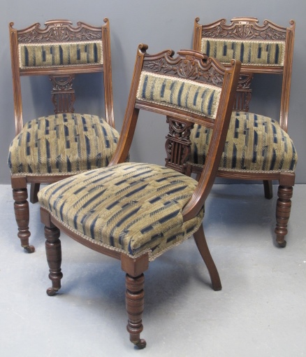 A SET OF SIX VICTORIAN WALNUT SIDE CHAIRS having carved foliate and lyre back decoration with stuff