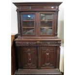17th Century style carved oak two stage cabinet back bookcase. (B.P. 24% incl.