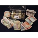 Plastic box of assorted GB and foreign coinage and a collection of bank notes: Spain, Kenya,