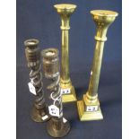 Pair of aesthetic brass candlesticks, together with another pair of turned, wooden,