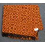 Orange ground vintage woollen fringed blanket with black geometric design. (B.P. 24% incl.