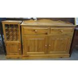 A modern pine two door sideboard on a platform base,