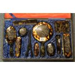 Oriental design faux tortoiseshell lady's vanity set, decorated with dragons, in fitted case. (B.P.