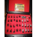 Two cases and a box of Warhammer lead and plastic figurines from the early 90's. (B.P. 24% incl.