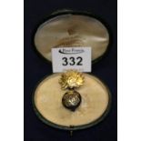 A silver and silver gilt fusilier brooch. (B.P. 24% incl.