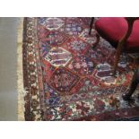 Large hand woven Middle Eastern design carpet with repeating lozenge fields,