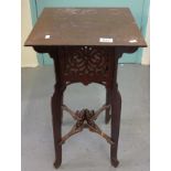 Small stained lamp table of square form with carved, fret cut decoration. (B.P. 24% incl.