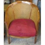 Bergere double caned tub type chair. (B.P. 24% incl.