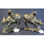 Pair of Chinese carved hardwood studies of a boy on a buffalo,