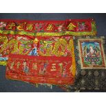 Three oriental wall hangings, two embroidered, one relief embroidered with dragons, waves, fish,